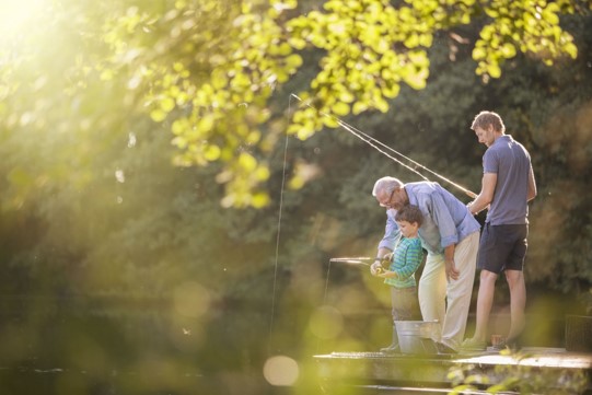 Grandfather, father, and son fishing - an example of patience