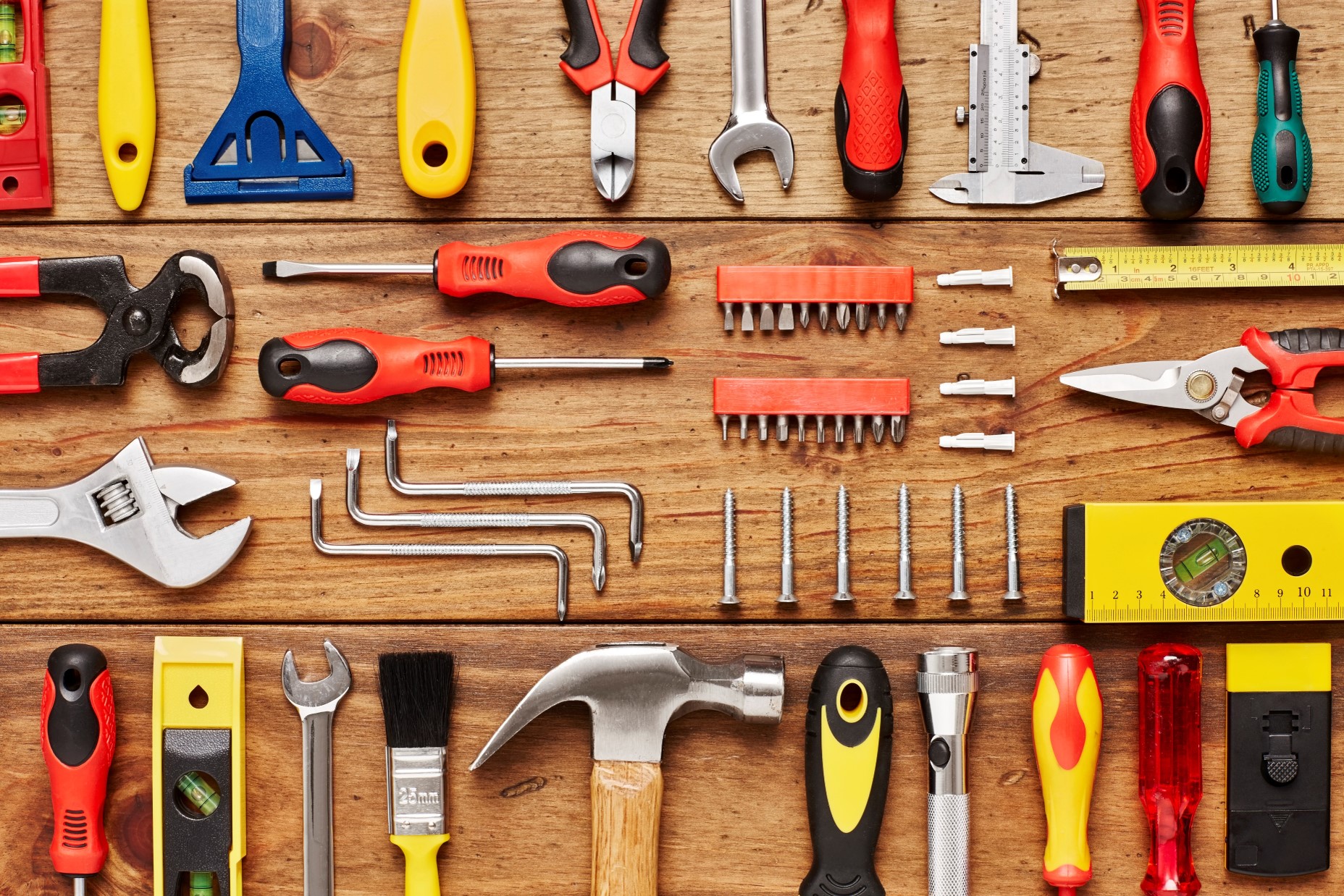 Individual carpenter tools neatly arrayed on a table